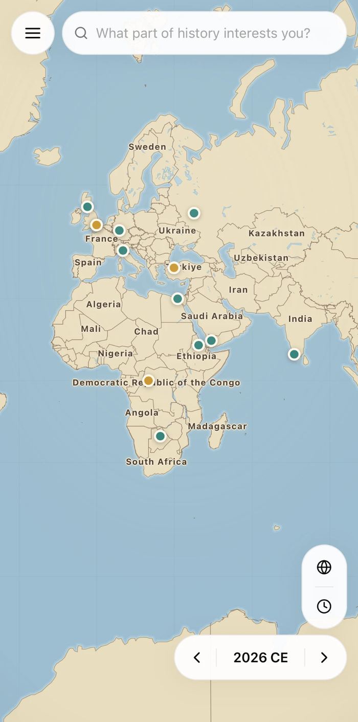 The Cartalore atlas at 2026 CE spanning Europe, Africa, the Middle East and India, with story pins across Britain, central Europe, Ukraine, Türkiye, Egypt, the Horn of Africa, the Congo, southern Africa and Sri Lanka.